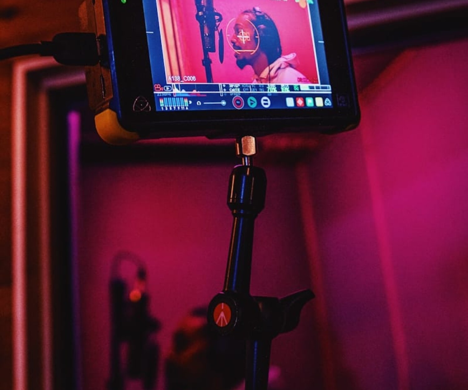 black and silver camera with tripod